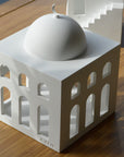 rasm mosque sculpture placed on table photo